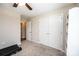 A well-lit bedroom with a neutral color scheme, carpeted floors, and a spacious closet at 50 Serenity Ln, Hickory, NC 28601