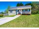 Lovely home with a charming front porch, perfect for enjoying the outdoors at 50 Serenity Ln, Hickory, NC 28601