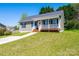 Charming single-story home with a covered front porch and well-manicured lawn at 50 Serenity Ln, Hickory, NC 28601