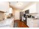 Bright kitchen featuring stainless steel appliances, white cabinetry, and granite countertops at 50 Serenity Ln, Hickory, NC 28601