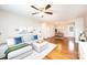 Bright living room boasts hardwood floors, a ceiling fan, and neutral decor, flowing into the dining area at 50 Serenity Ln, Hickory, NC 28601