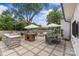 Spacious backyard patio featuring an outdoor kitchen, dining and seating areas, perfect for entertaining at 5501 Murrayhill Rd, Charlotte, NC 28210