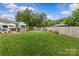 Expansive backyard with lush lawn, well manicured landscape, and a privacy fence, creating a serene outdoor space at 5501 Murrayhill Rd, Charlotte, NC 28210