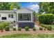 Relaxing backyard featuring a hot tub, manicured landscaping, and patio at 5501 Murrayhill Rd, Charlotte, NC 28210