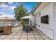 A covered patio with a large TV and outdoor dining, perfect for enjoying meals and entertainment at 5501 Murrayhill Rd, Charlotte, NC 28210