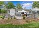 Expansive backyard with outdoor kitchen, entertainment area, and lush lawn, providing ample room for leisure at 5501 Murrayhill Rd, Charlotte, NC 28210