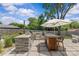 Backyard outdoor kitchen featuring stainless steel grill and dining area, excellent for gatherings at 5501 Murrayhill Rd, Charlotte, NC 28210