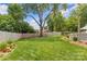 Well maintained backyard and privacy fence featuring flower beds, enhancing the natural beauty of the landscape at 5501 Murrayhill Rd, Charlotte, NC 28210