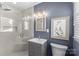 Elegant bathroom featuring a walk-in glass shower, modern vanity and a picture window at 5501 Murrayhill Rd, Charlotte, NC 28210