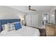 Bright bedroom with hardwood floors, a neutral color palette, and access to a private bath at 5501 Murrayhill Rd, Charlotte, NC 28210