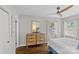 Cozy bedroom with neutral tones, ceiling fan, and natural light coming through the windows at 5501 Murrayhill Rd, Charlotte, NC 28210