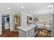 Bright kitchen with a quartz island, stainless appliances, dark wood floors and a breakfast nook at 5501 Murrayhill Rd, Charlotte, NC 28210
