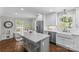 Well-appointed kitchen with white cabinetry, a center island, and stainless steel appliances at 5501 Murrayhill Rd, Charlotte, NC 28210