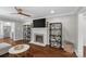 Living room showcasing a fireplace and open view of the kitchen and breakfast nook at 5501 Murrayhill Rd, Charlotte, NC 28210
