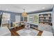 A charming playroom with ample natural light, blue walls, and a cozy reading nook at 5501 Murrayhill Rd, Charlotte, NC 28210