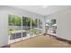 Sunroom featuring large windows with views of the backyard, patio area, and hot tub at 5501 Murrayhill Rd, Charlotte, NC 28210