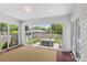 Bright sunroom with large windows offering views of a private backyard and hot tub at 5501 Murrayhill Rd, Charlotte, NC 28210
