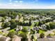 Neighborhood aerial view featuring tree lined streets and suburban homes at 5822 Parkstone Dr, Matthews, NC 28104