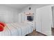 Bedroom with large bed, tv, dresser, closet and view to entry door at 5822 Parkstone Dr, Matthews, NC 28104