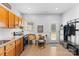 Functional kitchen with ample cabinetry, granite counters, black appliances, and convenient access to the backyard at 5822 Parkstone Dr, Matthews, NC 28104