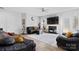 Comfortable living room with fireplace, ceiling fan, and sliding door access to outdoor space at 5822 Parkstone Dr, Matthews, NC 28104