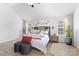 Bright main bedroom with vaulted ceiling, wood floors and lots of natural light at 5822 Parkstone Dr, Matthews, NC 28104