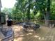 Inviting back deck featuring outdoor seating and a serene view of the backyard at 6632 Summer Darby Ln, Charlotte, NC 28270