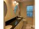 Bathroom featuring double sinks, granite countertop, and large mirror at 6632 Summer Darby Ln, Charlotte, NC 28270