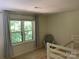 Comfortable bedroom featuring a twin bunk bed and a window view at 6632 Summer Darby Ln, Charlotte, NC 28270
