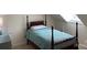 Cozy bedroom with a four-poster bed and a dresser at 6632 Summer Darby Ln, Charlotte, NC 28270