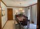 Dining room with rustic table, neutral walls and natural light at 6632 Summer Darby Ln, Charlotte, NC 28270