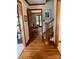 Inviting entryway with hardwood floors, wood trim, and an open view to the living room at 6632 Summer Darby Ln, Charlotte, NC 28270
