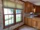 Wood cabinets, granite countertop and large windows with nature views make this kitchen appealing at 6632 Summer Darby Ln, Charlotte, NC 28270