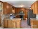 Traditional kitchen featuring wood cabinets, granite countertops and stainless steel appliances at 6632 Summer Darby Ln, Charlotte, NC 28270