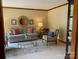 Cozy living room featuring comfortable seating, a round mirror and hardwood trim at 6632 Summer Darby Ln, Charlotte, NC 28270