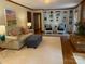 Spacious living room featuring hardwood floors, a brick fireplace and neutral paint at 6632 Summer Darby Ln, Charlotte, NC 28270