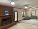Inviting living room with a brick fireplace, neutral tones, and ample seating at 6632 Summer Darby Ln, Charlotte, NC 28270