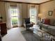 Bright living room with natural light and comfortable armchair at 6632 Summer Darby Ln, Charlotte, NC 28270