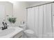 Clean and simple bathroom with a vanity and shower with curtain at 6720 Long Nook Ln, Indian Trail, NC 28079