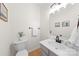 A cozy half bathroom featuring modern fixtures, a mirror, and a decorative plant at 6720 Long Nook Ln, Indian Trail, NC 28079