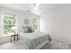 Cozy bedroom with a ceiling fan and sun-filled windows at 6720 Long Nook Ln, Indian Trail, NC 28079