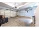 Spacious garage with ample storage, shelving, light blue walls, and an automatic garage door opener at 6720 Long Nook Ln, Indian Trail, NC 28079