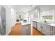 Open kitchen featuring an island, stainless steel appliances, and bright lighting at 6720 Long Nook Ln, Indian Trail, NC 28079