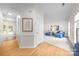 Bright foyer transitioning to a cozy living room with plush carpet, natural light, and modern decor at 6720 Long Nook Ln, Indian Trail, NC 28079