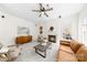 Bright living room with a fireplace, comfortable seating, and lots of natural light at 6720 Long Nook Ln, Indian Trail, NC 28079