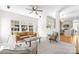 Open-concept living room with abundant natural light, neutral tones, and seamless transition to the kitchen at 6720 Long Nook Ln, Indian Trail, NC 28079