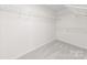 Walk-in closet featuring new carpet, white walls and ample metal shelving at 6720 Long Nook Ln, Indian Trail, NC 28079