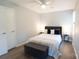 Bright bedroom with a ceiling fan, wood floors, and a cozy, comfortable bed at 8012 Red Lantern Rd, Indian Trail, NC 28079