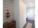 Cozy entryway showcasing a decorative lantern and a stylish accent wall at 8012 Red Lantern Rd, Indian Trail, NC 28079