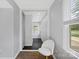 Bright hallway featuring tile flooring and natural light coming from a window at 8012 Red Lantern Rd, Indian Trail, NC 28079